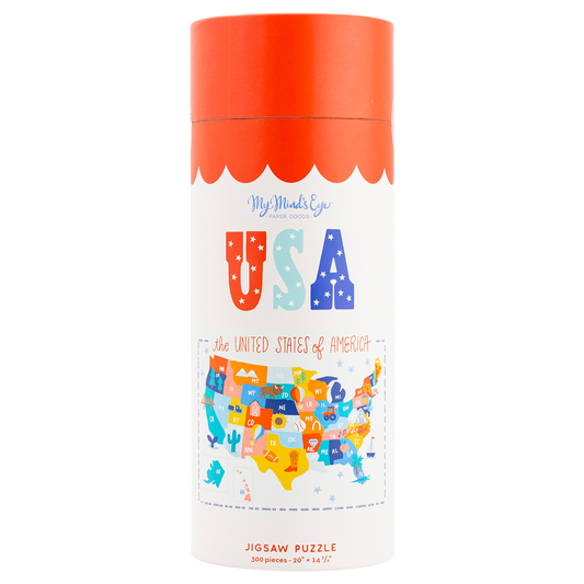 This USA 300 piece puzzle on a rectangular puzzle background with the shape of the United States of  America with fun bright colors and the letters in a cartoon, kid like font with logos scattered throughout to represent different areas in USA
